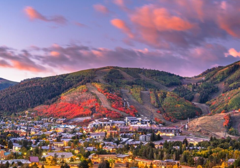 Colorful autumn mountain town at sunset.