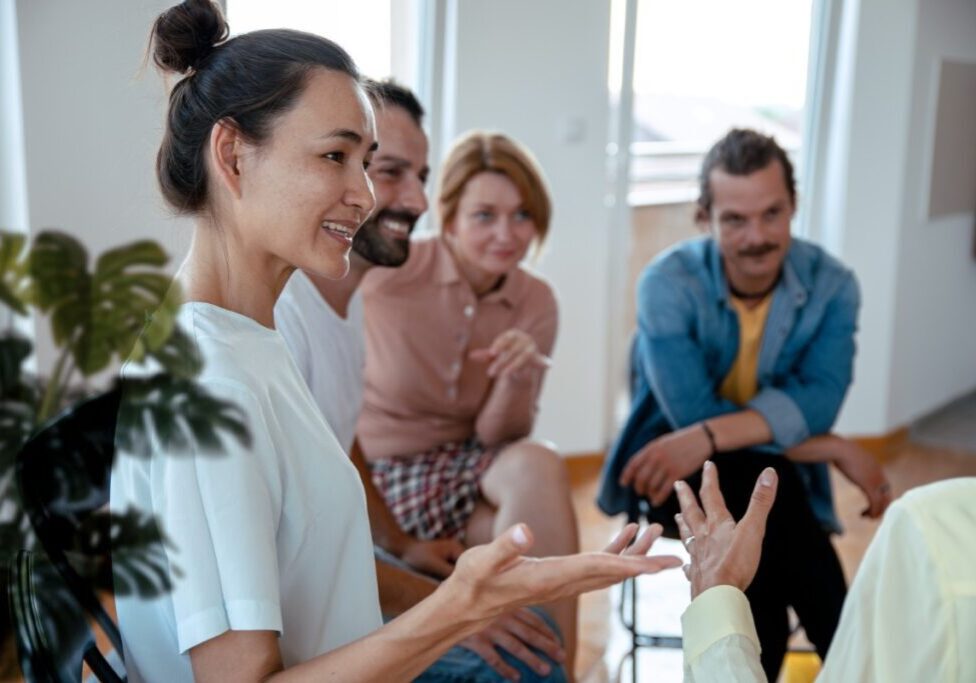 Group having a discussion in a room.
