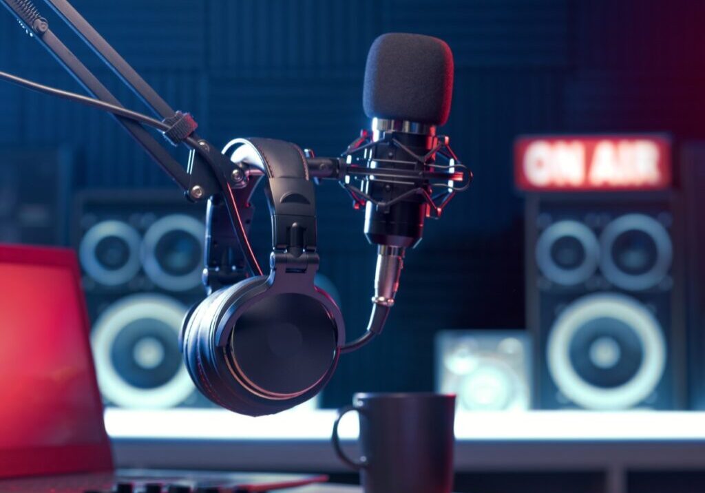 Podcast studio setup with microphone and headphones.
